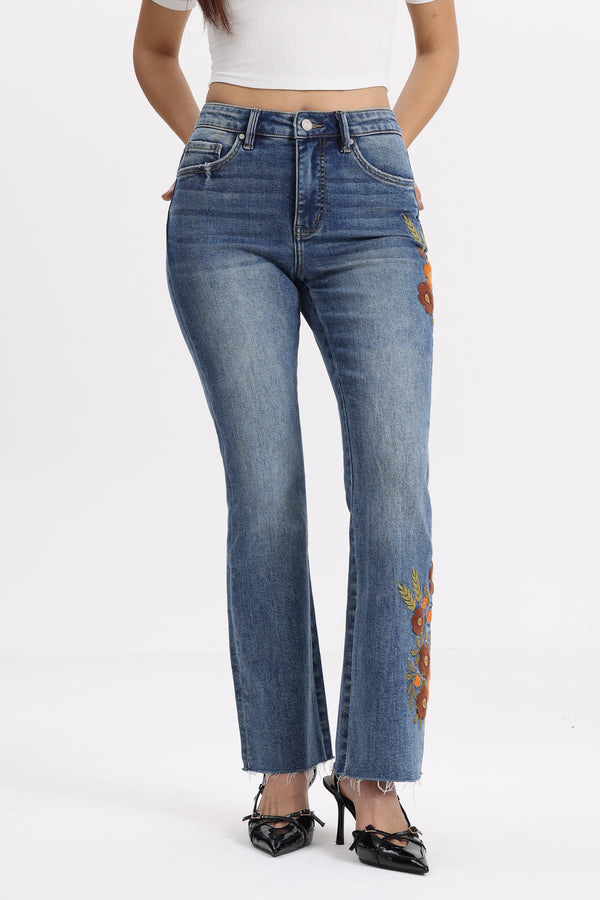 Mid Rise Floral Embroidered Raw Hem Bootcut Jeans