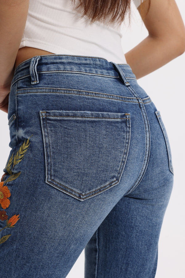 Mid Rise Floral Embroidered Raw Hem Bootcut Jeans