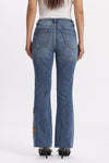 Mid Rise Floral Embroidered Raw Hem Bootcut Jeans