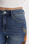 Mid Rise Floral Embroidered Raw Hem Bootcut Jeans
